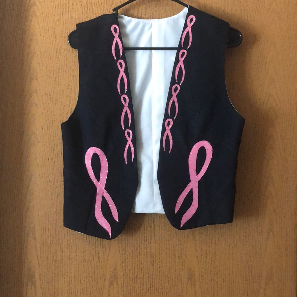 Denim vest with pink ribbons